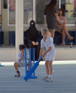 I love this photo - it's our Boy playing cricket for the school with a fully covered lady in the background - it is all so incredibly normal