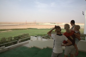 The extraordinary sight of a camel race track and site of the Al Dhafrah Camel Festival which includes the world's only camel beauty contest on the edge of the desert