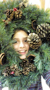 Getting into the spirit of Christmas - the Eldest 'helping' with the Christmas wreath