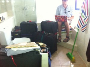 The chaos of moving - FoTT surrounded by baggage bound for the UK attempting to work in the only room not full of packers: the bathroom.  
