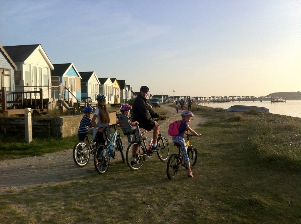 The Tribe outside the pretty beach huts